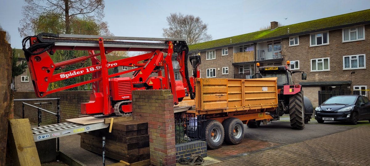 tracking the spider cherry picker over homemade bridge to access inside st Johns church in Derby