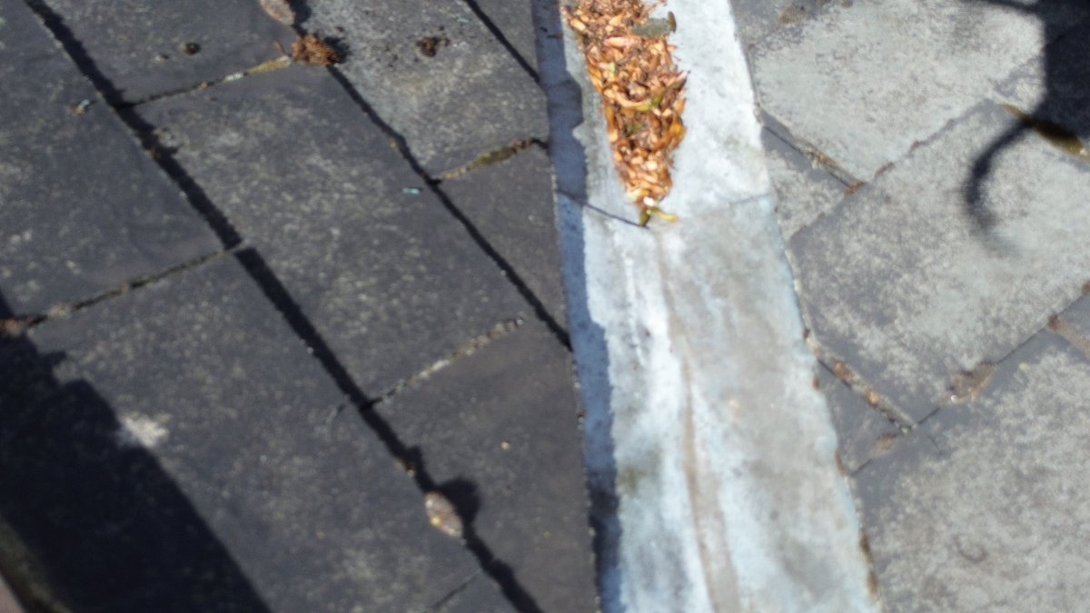photo shows the poor condition of the leadwork in a roof valley situated in Mapperley Park, Nottingham