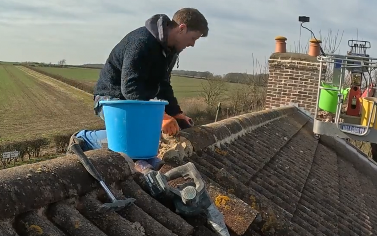 Danny Iwanejko re-bedding a ridge tile in Nottinghamshire