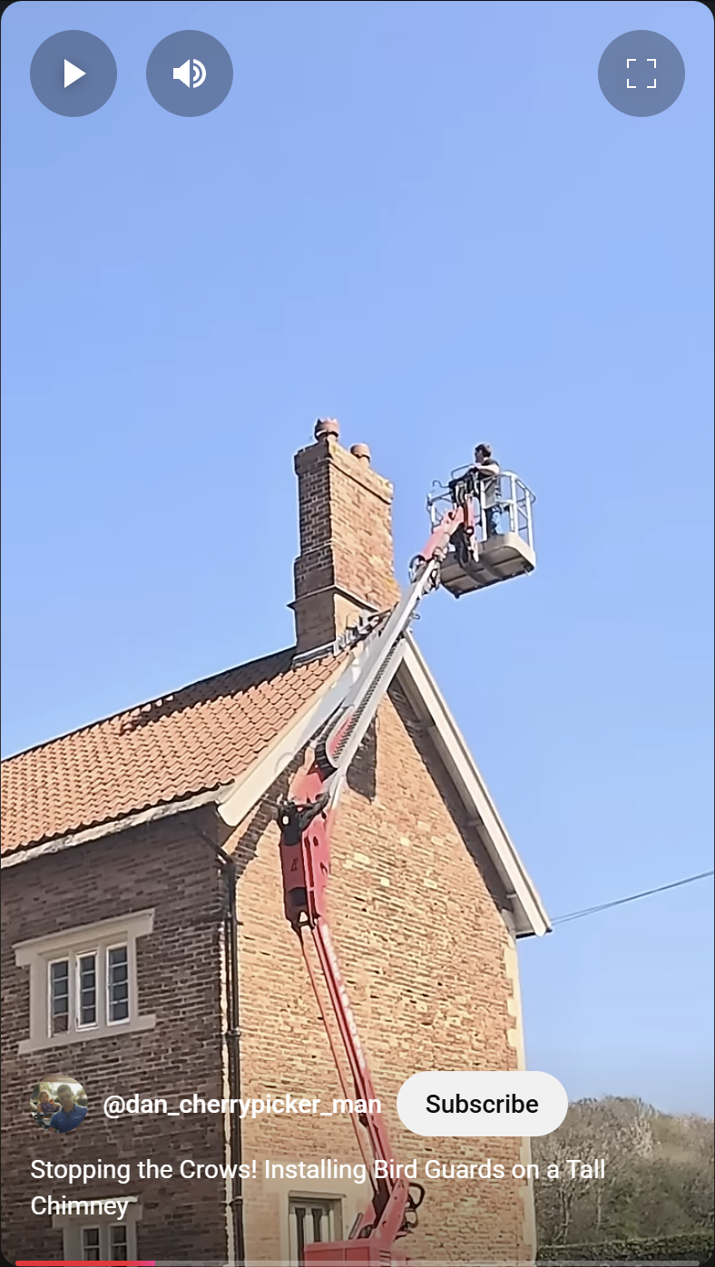 A cherrypicker booming up to a tall chimney to assist with the installation of a bird guard, Nottinghamshire