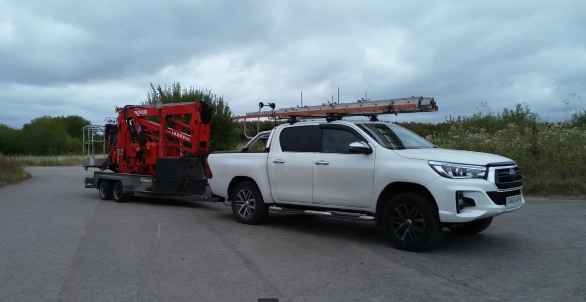 photo show DJI High Access Services Toyota Hilux, and its platformbasket tracked 1890 pro spider cherrypicker on a trailer